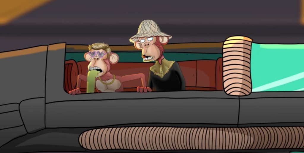 two apes in a car, one is puking, one is yelling in traffic.